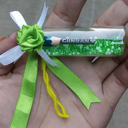 Pencil Art With Green Ribbon